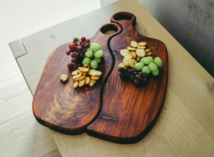 green grapes on brown wooden heart shaped tray